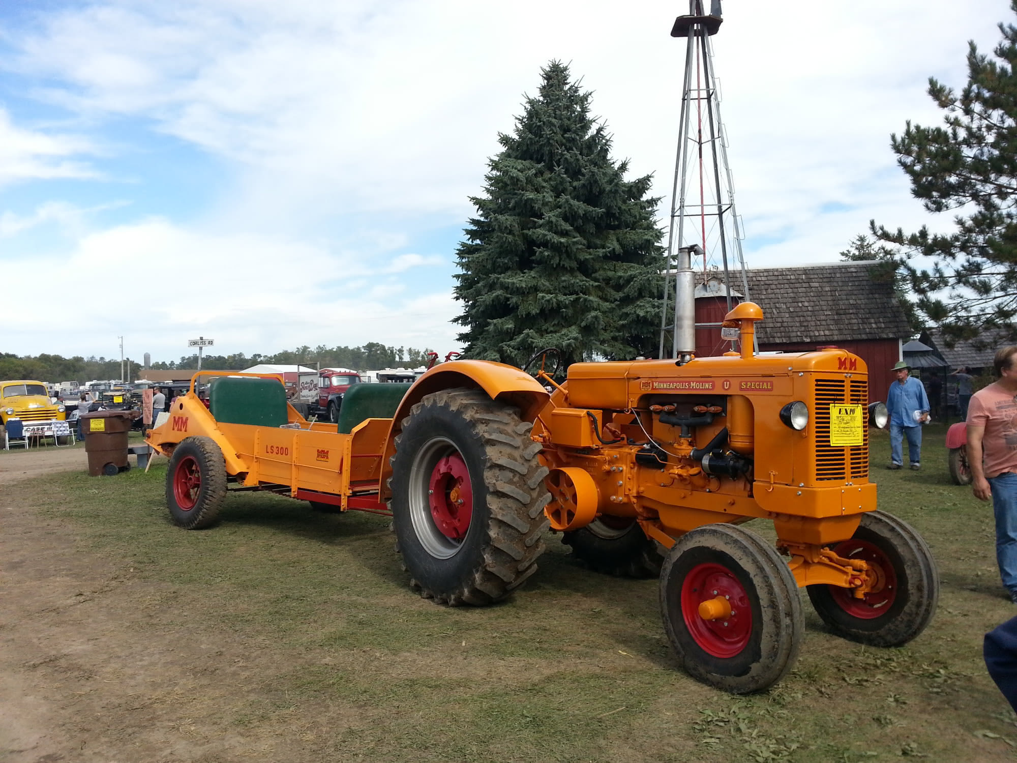 A close-up of a row of vintage tractors